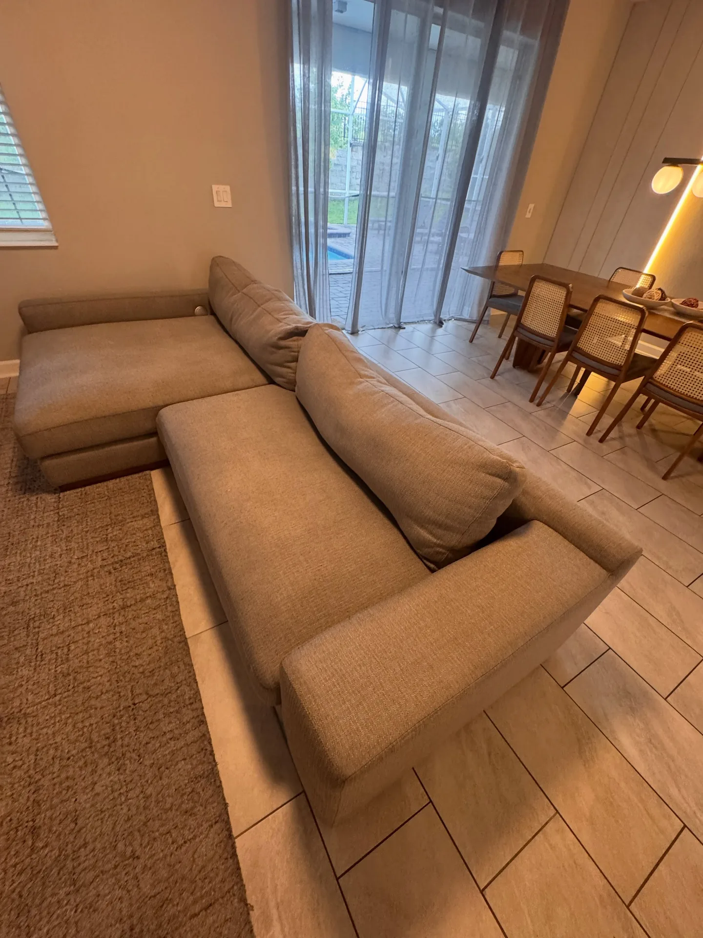 Light sectional sofa from the reverse angle after professional upholstery cleaning by Everglades Cleaning Solution