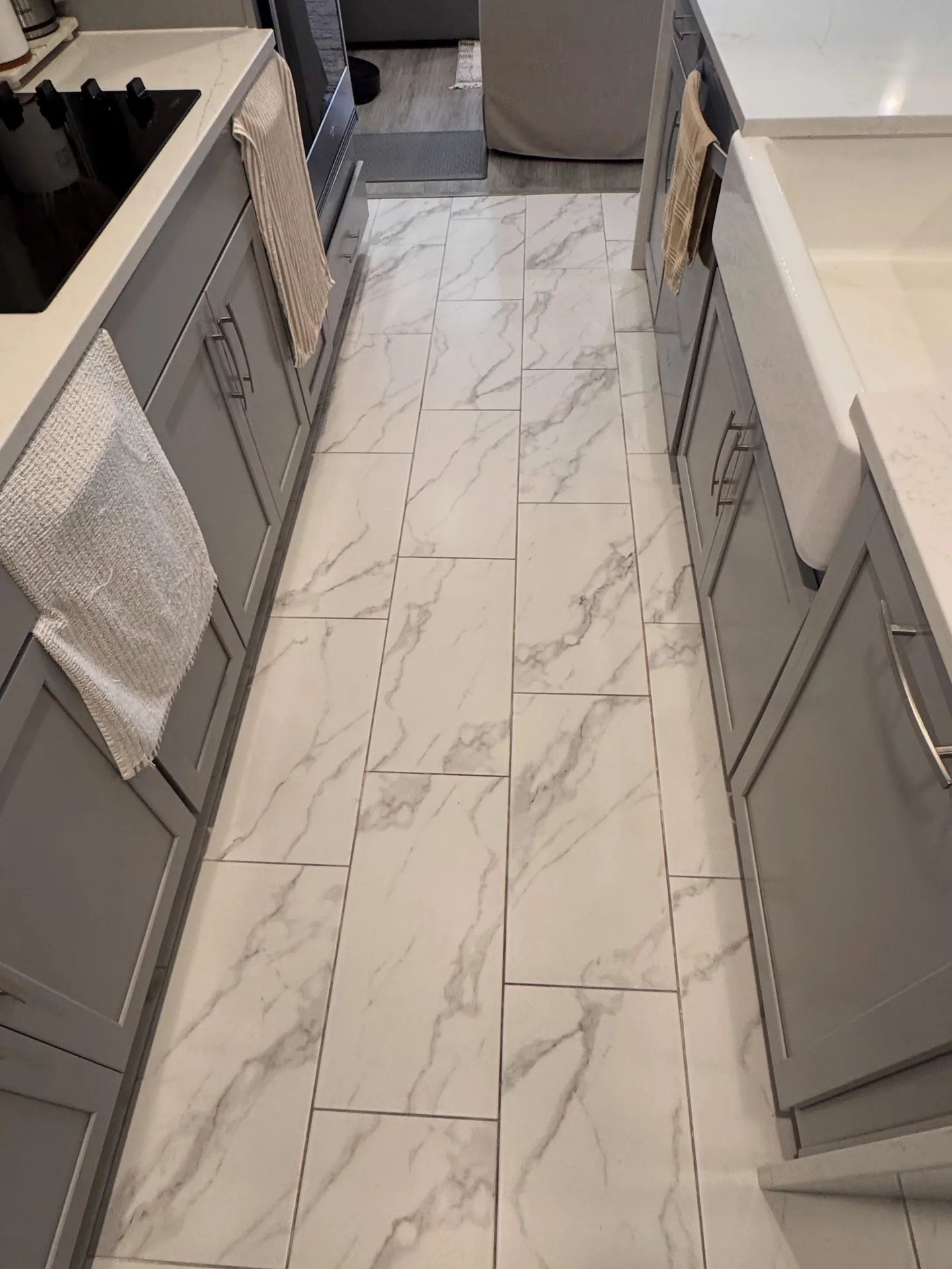 White kitchen tile and grout floor before professional tile & grout by Everglades Cleaning Solution