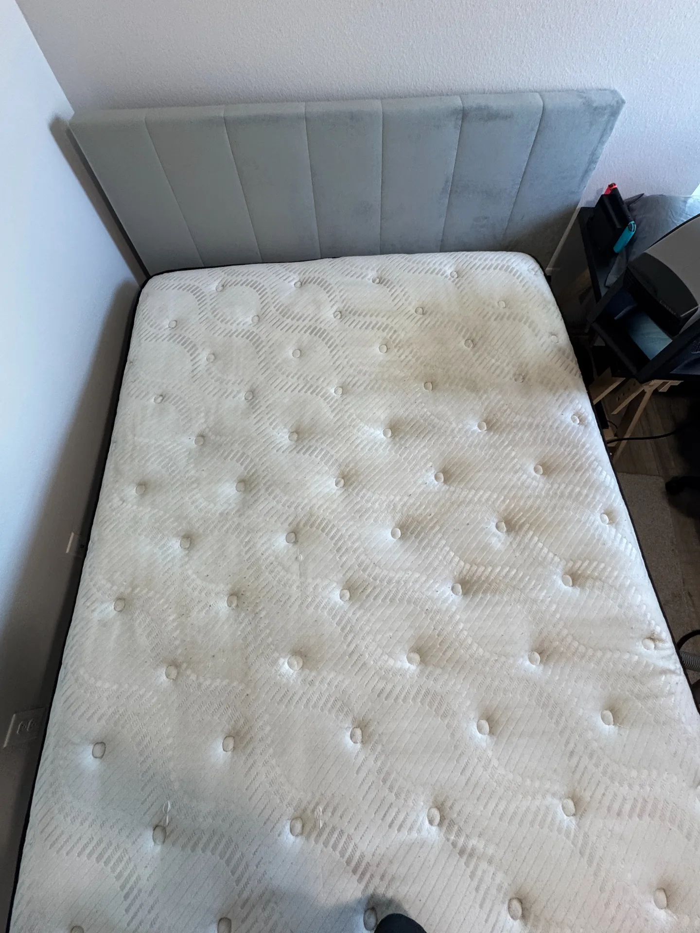 Light mattress with visible surface marks after professional mattress cleaning by Everglades Cleaning Solution