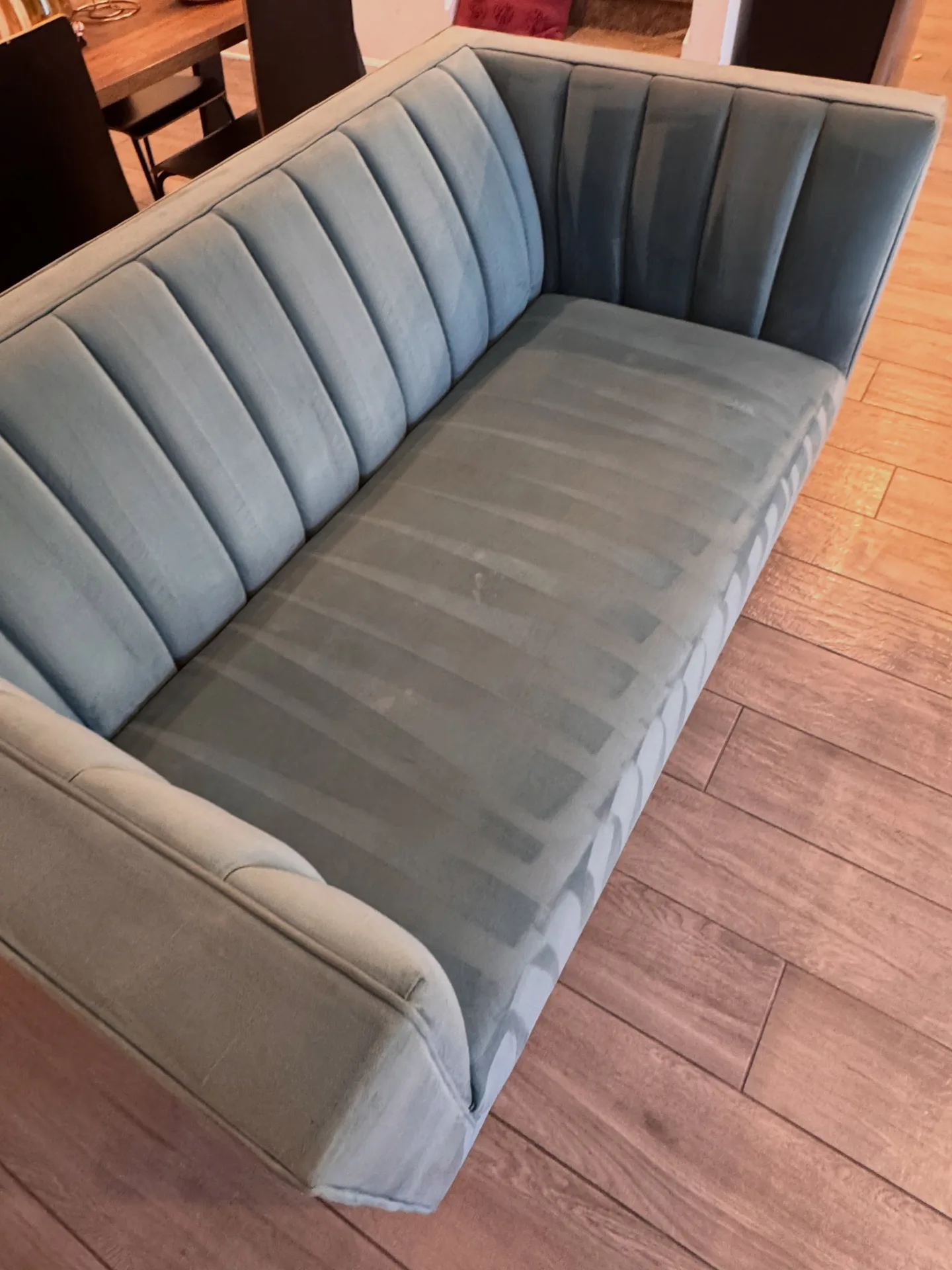 Light-fabric sofa from the side after professional upholstery cleaning by Everglades Cleaning Solution
