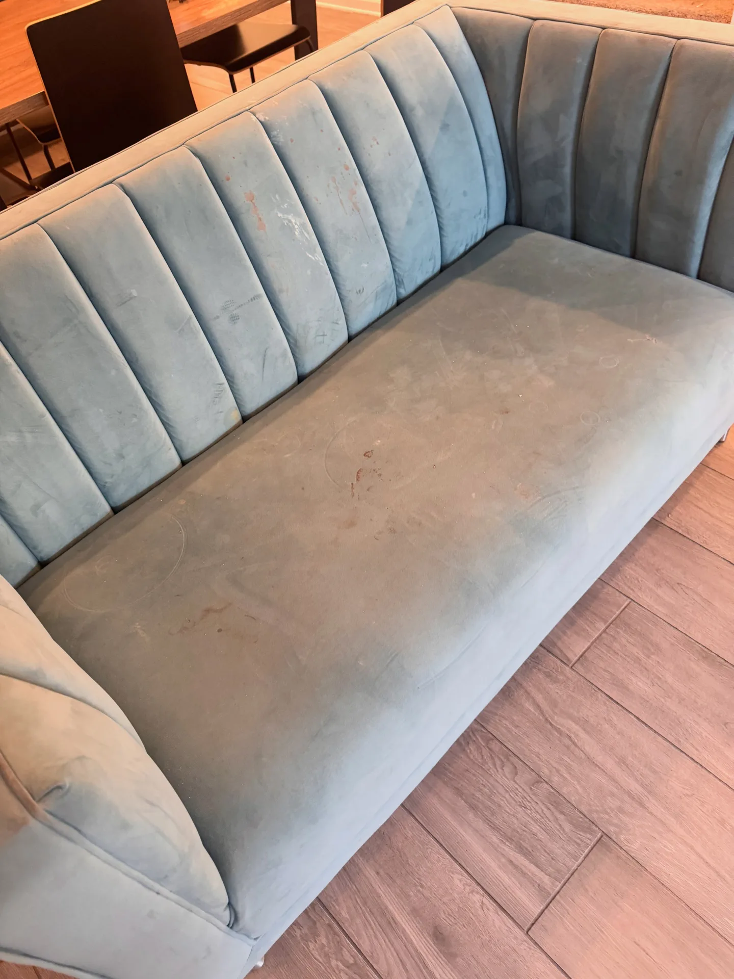 Light-fabric sofa from the side before professional upholstery cleaning by Everglades Cleaning Solution